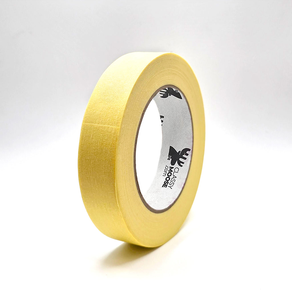roll of yellow masking tape on a white background