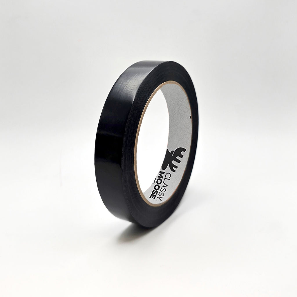 Roll of black tape with a visible brand logo on a white background