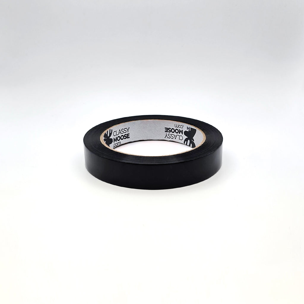 Black tape with a label on a white background