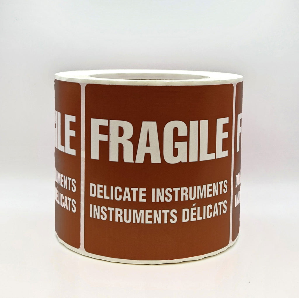 A brown label with white text that reads 'FRAGILE DELICATE INSTRUMENTS' in both English and French. Side view