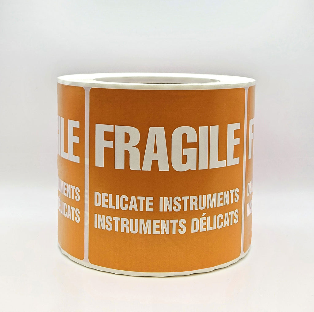 An orange label with white text that reads 'FRAGILE DELICATE INSTRUMENTS' in both English and French. Side view
