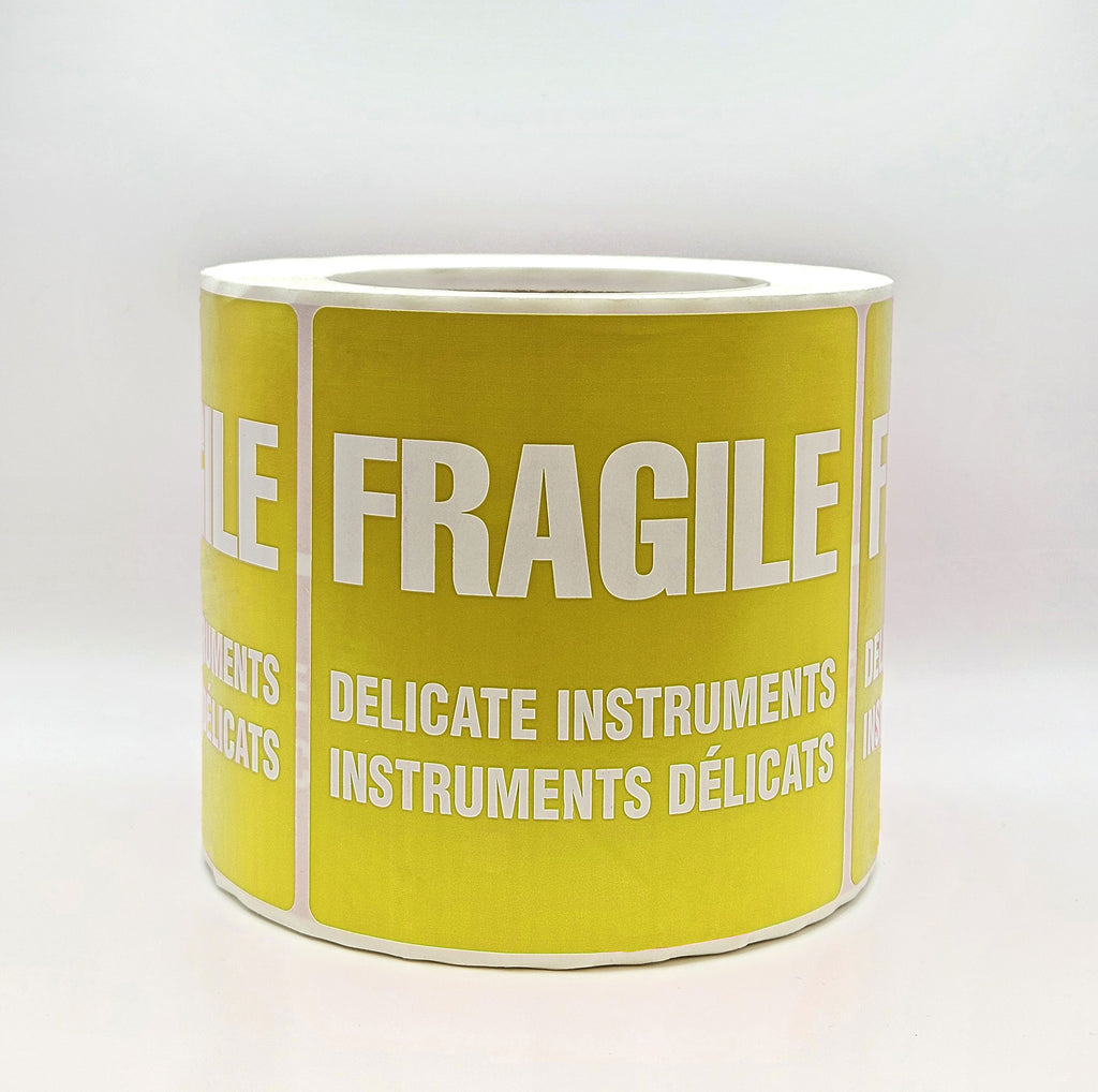 A yellow label with white text that reads 'FRAGILE DELICATE INSTRUMENTS' in both English and French. Side view 