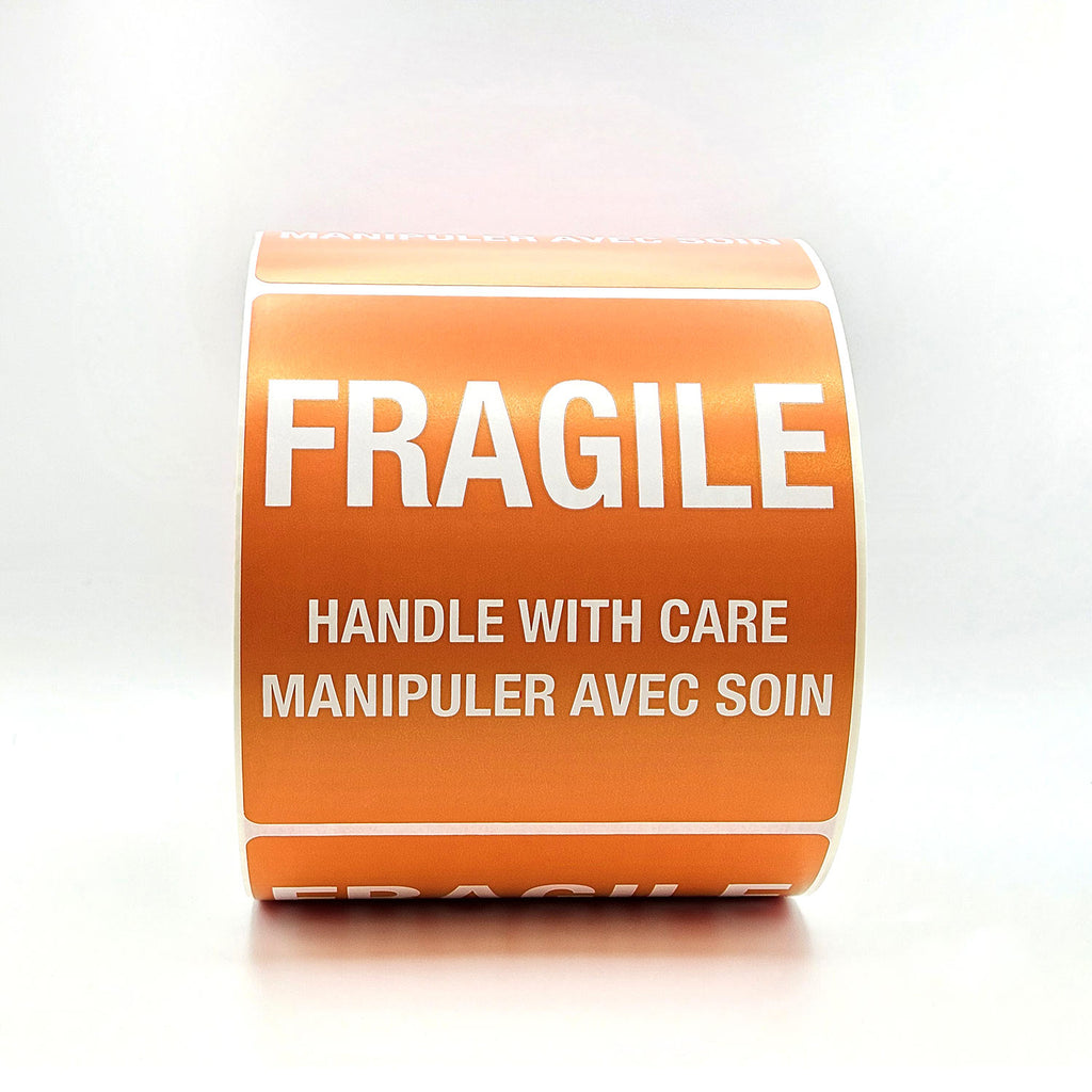 Roll of orange 'Fragile' labels with text on a white background