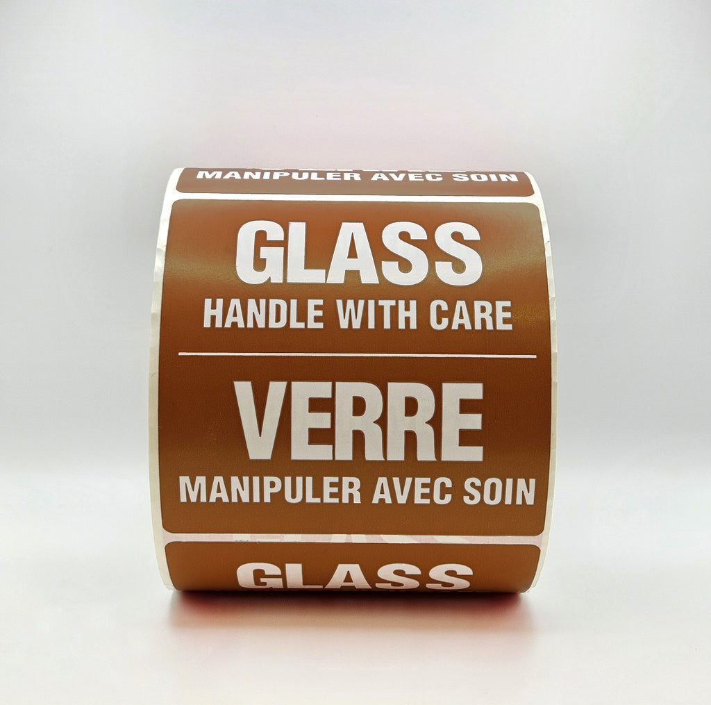 Roll of glass handling labels with text in multiple languages on a white background
