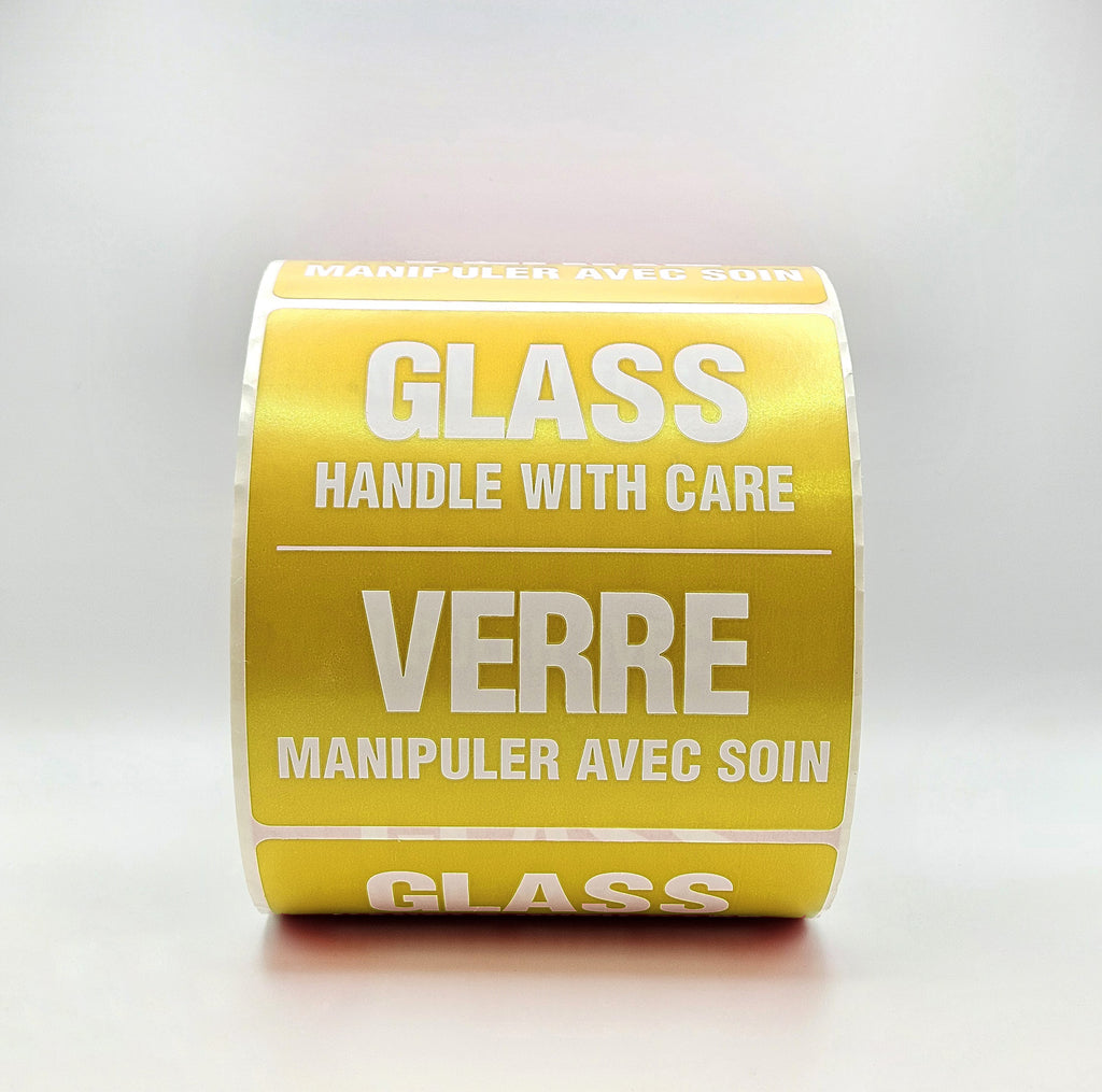 Roll of yellow labels with 'Glass Handle with Care' text on a white background