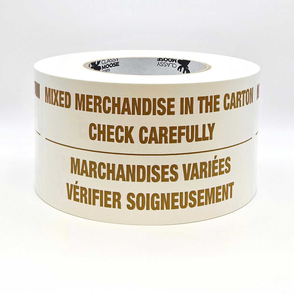 A roll of labels with the text 'MIXED MERCHANDISE IN THE CARTON CHECK CAREFULLY' printed in English and French, indicating bilingual packaging required. Flat view in brown