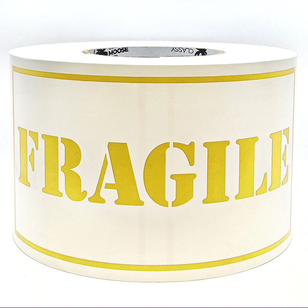A roll of 'Fragile' sticker labels with the word 'Fragile' printed in yellow on a white background with borders.
