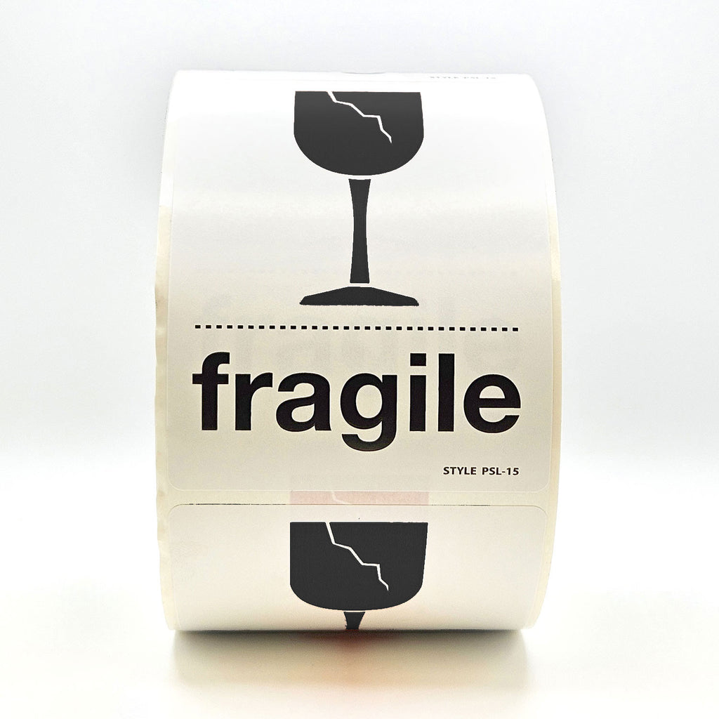 A roll of white labels with 'fragile' text and a broken glass pictogram in black.