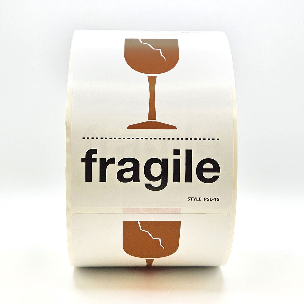 A roll of white labels with 'fragile' text and a broken glass pictogram in brown and black.