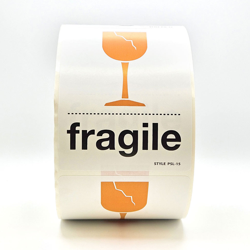 A roll of white labels with 'fragile' text and a broken glass pictogram in orange and black.