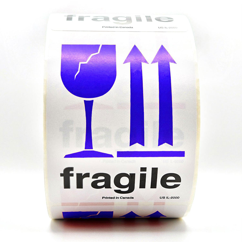 A roll of white shipping labels with 'Fragile' text and a blue broken glass symbol, and arrows pointing up on it. Front view
