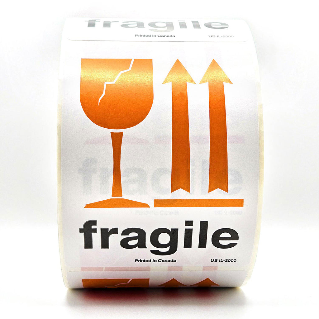 A roll of white shipping labels with 'Fragile' text and a orange broken glass symbol, and  arrows pointing up on it. Front view