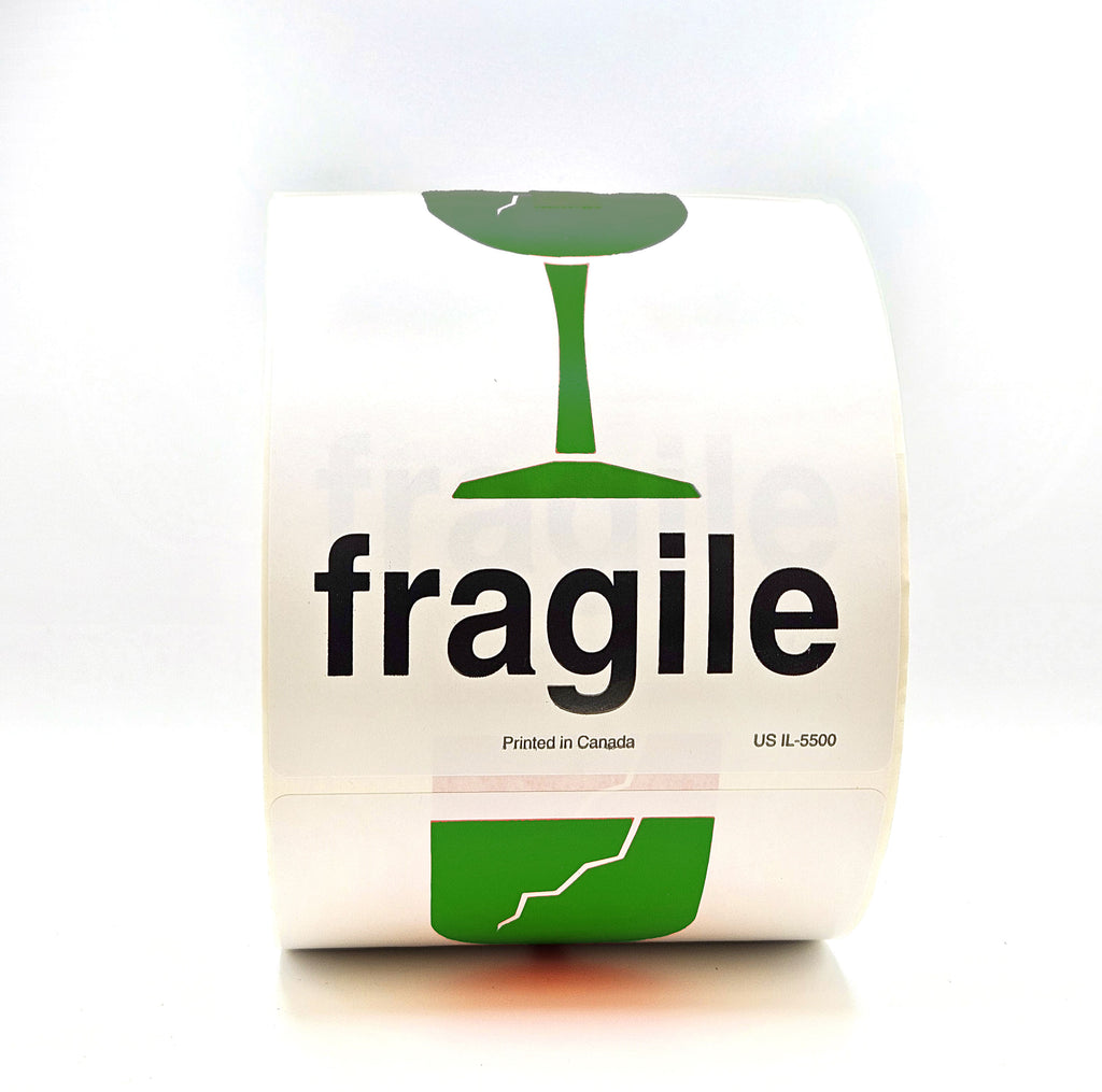 A roll of packing tape with 'fragile' text and a broken glass pictogram printed in green on a white background.