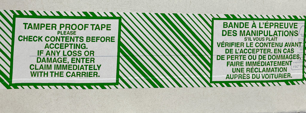 A roll of tamper-proof packing tape with green text and stripes on a white background, providing instructions to check contents before accepting and report any damage immediately.