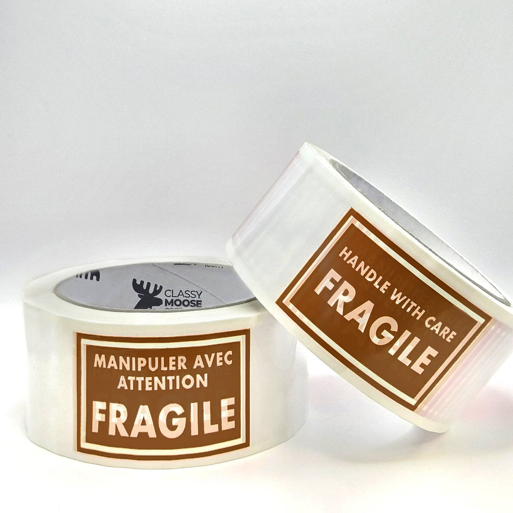Two rolls of tape with 'Fragile' labels on a white background