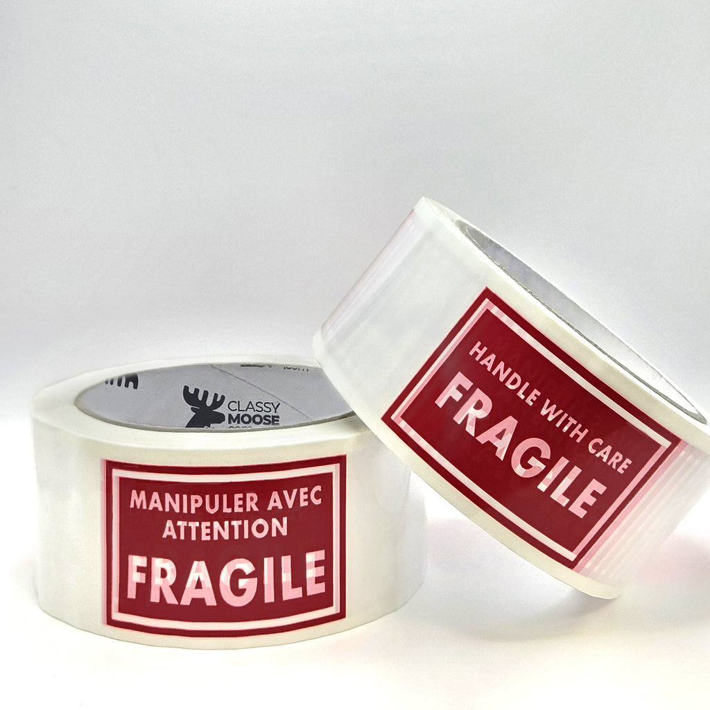 Two rolls of tape with 'Fragile' labels on a white background