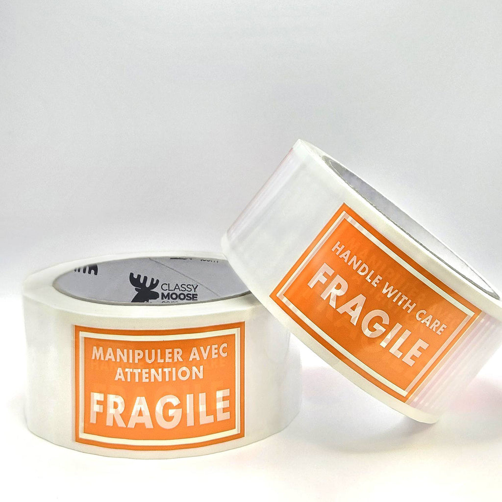 Two rolls of tape with 'Fragile' labels on a white background