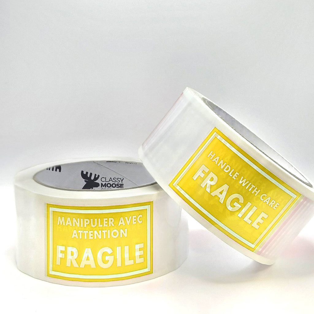 Two rolls of tape with 'Fragile' labels on a white background