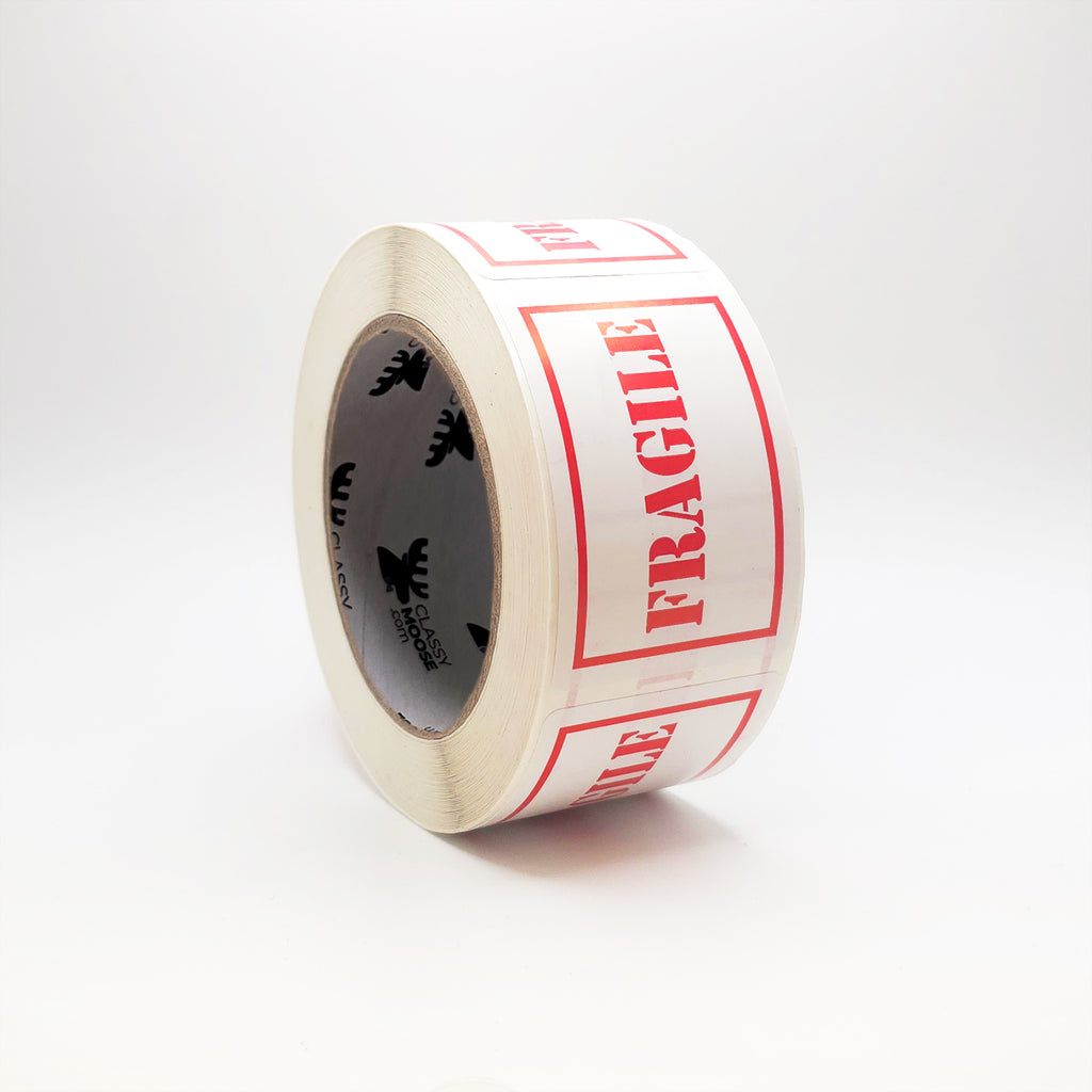 Roll of tape with 'Fragile' labels on a white background