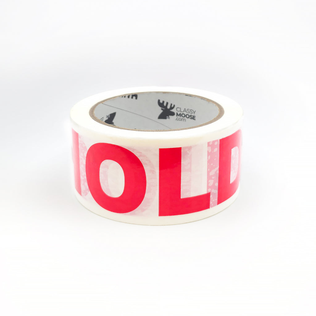 Roll of white tape with redtext on a white background