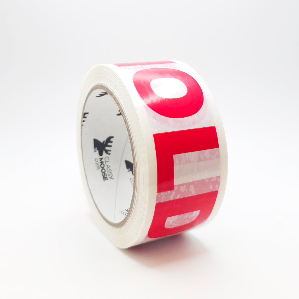 Roll of red and white tape on a white background
