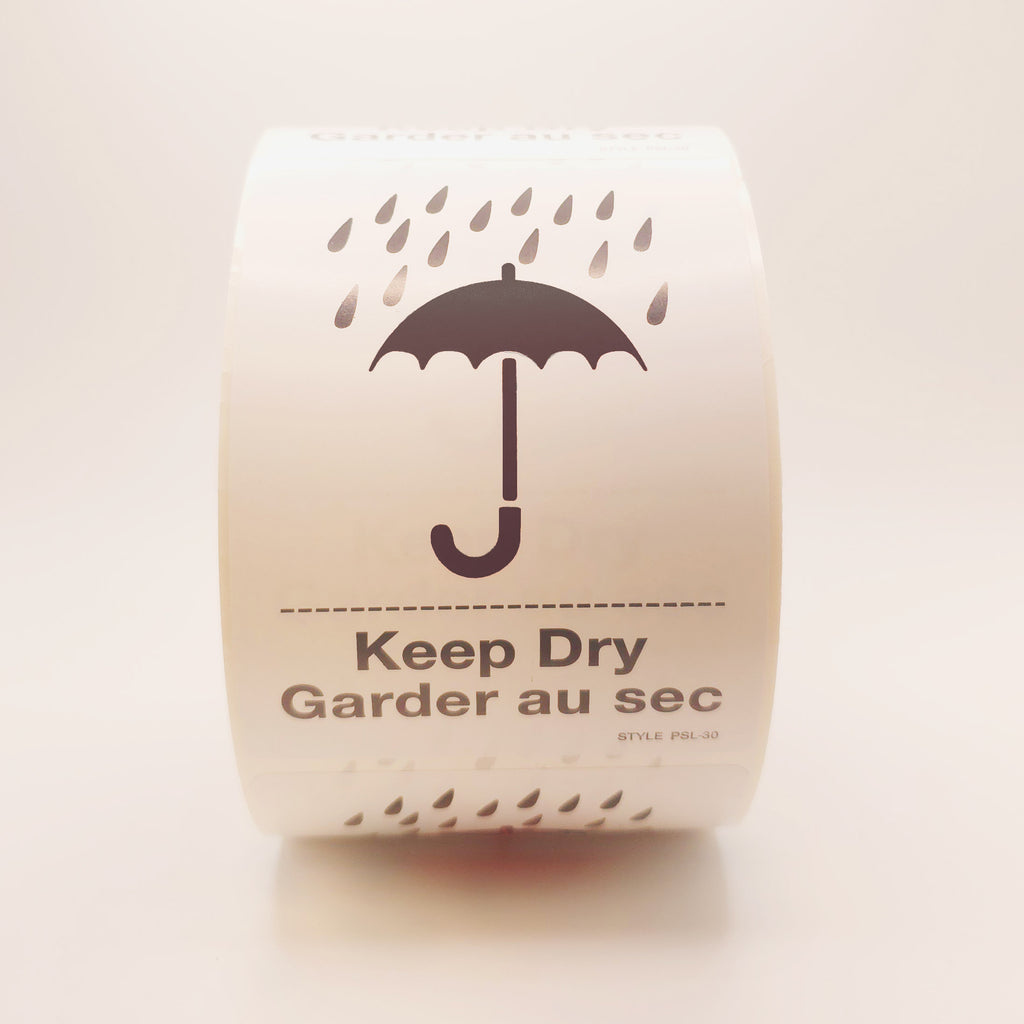Roll of labels with a black umbrella and raindrop design, labeled 'Keep Dry'. front view