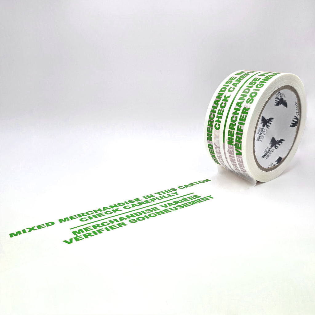 Roll of green tape with text on a white background